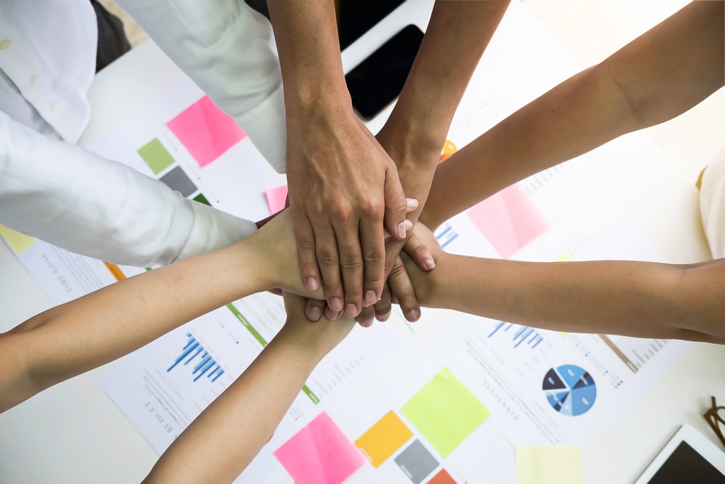 Group of People Joining Hands Together 